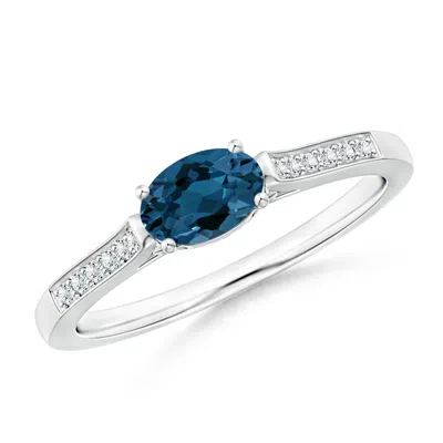 Angara East-west Oval London Blue Topaz Solitaire Ring With Diamonds In Metallic