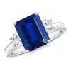 Angara Emerald-cut Lab-grown Blue Sapphire And Trapezoid Diamond Hidden Halo Engagement Ring In White Gold/deep Rich Blue