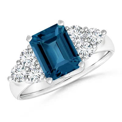 Angara Emerald Cut London Blue Topaz Ring With Trio Diamond Accents In Metallic
