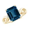 Angara Emerald Cut London Blue Topaz Twist Shank Statement Ring In Yellow Gold/deep Greenish Blue