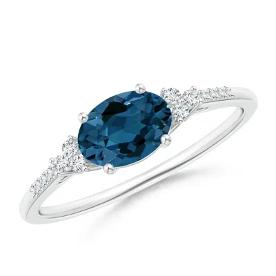 Angara Horizontally Set Oval London Blue Topaz Ring With Diamonds In Metallic