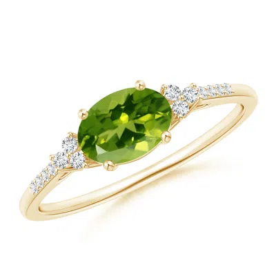 Angara Horizontally Set Oval Peridot Solitaire Ring With Trio Diamond Accents In Gold
