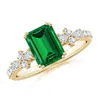 Angara Lab-grown Emerald-cut Emerald Side Stone Engagement Ring With Accents In Yellow Gold/rich Green