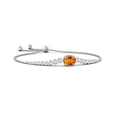 Angara Oval Citrine Bolo Bracelet With Bezel Diamonds In Metallic
