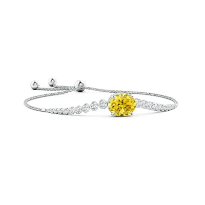 Angara Oval Fancy Intense Yellow Diamond Bolo Bracelet With Bezel Accents In Metallic