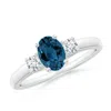 Angara Oval London Blue Topaz And Round Diamond Three Stone Ring In White Gold/greenish Blue