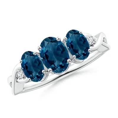 Angara Oval London Blue Topaz Three Stone Criss-cross Ring