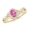 Angara Oval Pink Sapphire Crossover Ring With Diamond Halo In Yellow Gold/medium Pink