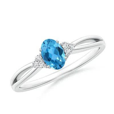 Angara Oval Swiss Blue Topaz Split Shank Ring With Trio Diamonds In Metallic