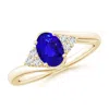 Angara Oval Tanzanite Bypass Ring With Trio Diamond Accents In Yellow Gold/deep Rich Violet Blue
