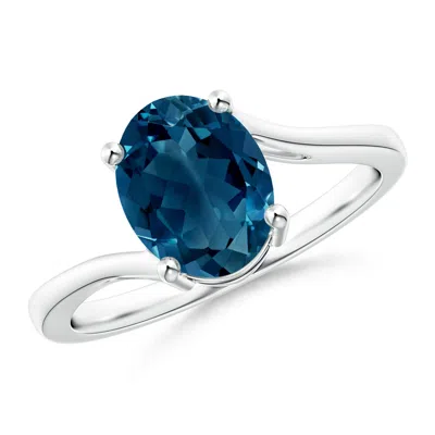 Angara Prong Set Oval London Blue Topaz Solitaire Bypass Ring In Metallic