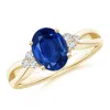Angara Solitaire Oval Blue Sapphire Split Shank Ring With Trio Diamonds In Yellow Gold/medium To Rich Blue