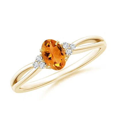 Angara Solitaire Oval Citrine Split Shank Ring With Trio Diamonds In Gold