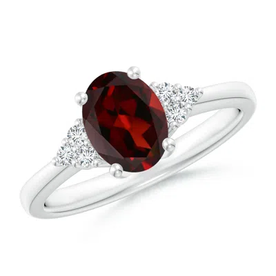 Angara Solitaire Oval Garnet Ring With Trio Diamond Accents In Metallic