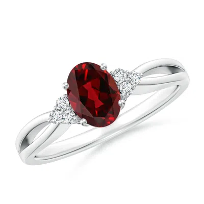 Angara Solitaire Oval Garnet Split Shank Ring With Trio Diamonds In Metallic