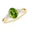 Angara Solitaire Oval Peridot Split Shank Ring With Trio Diamonds In Yellow Gold/green