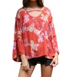 Angie Floral Ruffle Seam Bell Sleeve Tunic In Watermelon In Pink