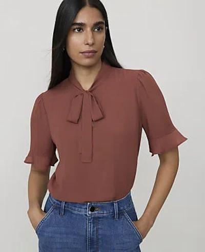 Ann Taylor Petite Ruffle Trim Bow Blouse In Amber Noir