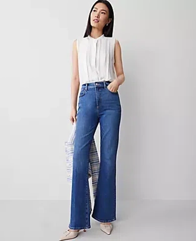 Ann Taylor The Petite Flare Jean In Luxe Medium Wash
