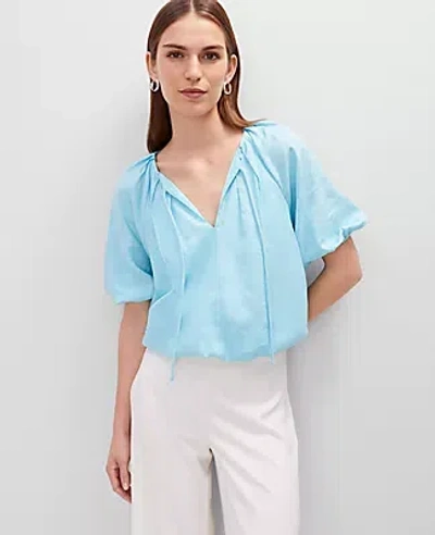 ANN TAYLOR TIE FRONT BUBBLE HEM BLOUSE