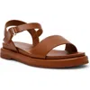 Anne Klein Elmer Flat Sandal In Cognac