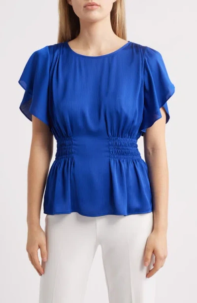 Anne Klein Flutter Sleeve Smock Waist Top In Santorini Blue
