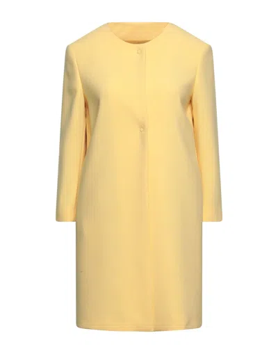 Annie P Overcoats In Yellow