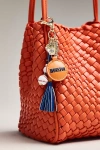 Anthropologie Baseball Bag Charm In Orange