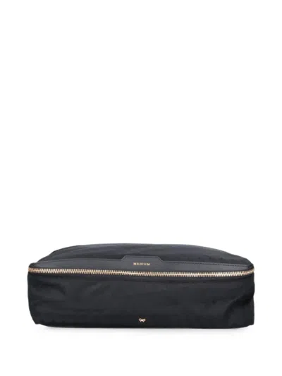ANYA HINDMARCH MONOGRAM-PRINT TASSEL-DETAIL CLUTCH BAG