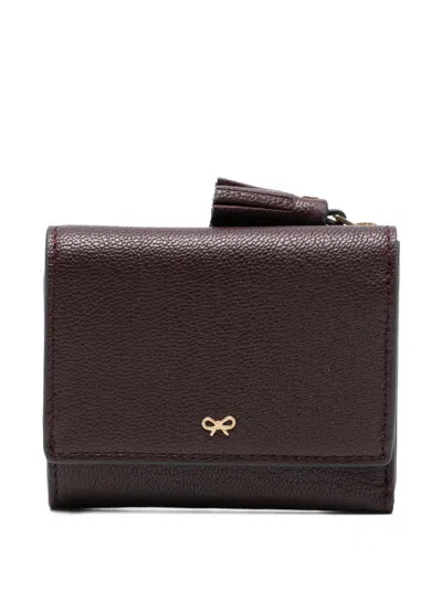 ANYA HINDMARCH PEEPING-EYESTASSEL TRIFOLD LEATHER WALLET