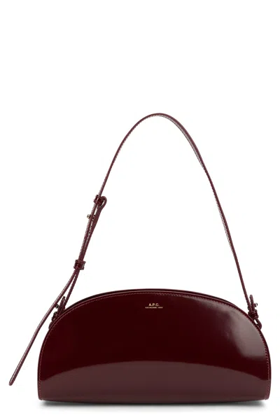 A.p.c. A. P.c. Leather Shoulder Handbag, Curved Mini Crossbody With Adjustable Strap In Burgundy