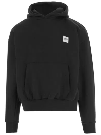 APRÈS SURF HOODED BLACK SWEATSHIRT WITH CONTRASTING LOGO AND KANGAROO POCKET
