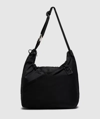 Arcs Hey Sling Bag In Black Criss Cross
