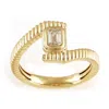 Artisan Women's Gold / White Emerald-cut Diamond Ribbed Bypass Ring In 14k Yellow Gold In Gold