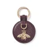 Aspinal Of London Bee Keyring In Purple