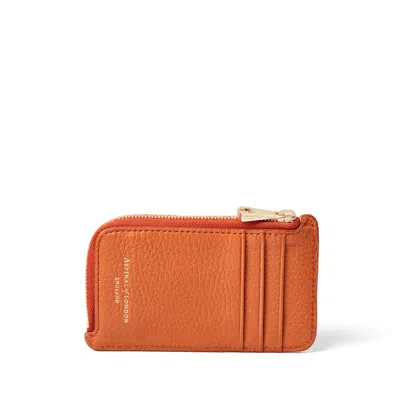 Aspinal Of London Zipped Coin & Card Holder In Marmalade Pebble In Orange