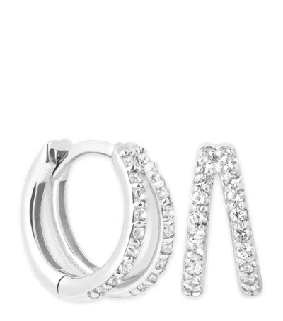 Astrid & Miyu White Gold And Topaz Illusion Huggie Earrings In Metallic