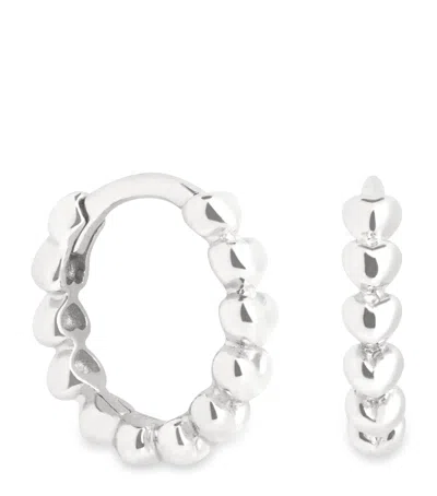 Astrid & Miyu White Gold Heart Huggie Earrings In Silver