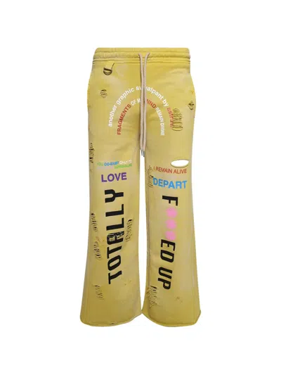 Astrum Graphic-print Track Pants In Yellow