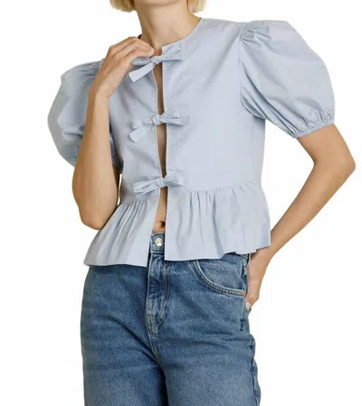 Aureum Knot Detail Peplum Top In Blue