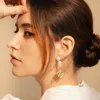 Aurozia Women's Gold The Alphabet Eye Letter Mother Of Pearl Shell Pendant Asymmetric Diamond Pearl Earrings In Gold