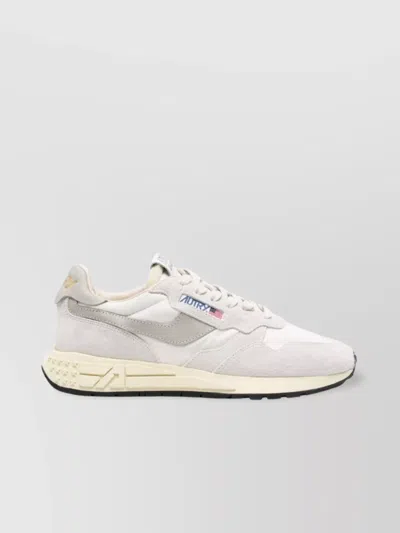 Autry Low-top Leather Sneakers With Embossed Sole In Gray