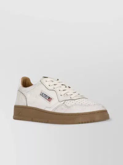 Autry Low Top Leather Sneakers With Perforated Round Toe In White