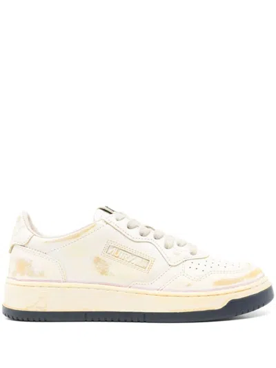 Autry Low-top Sneakers With Distressed Finish And Perforated Detailing In White