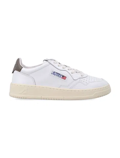 Autry Low-top Sneakers With Perforated Detailing And Contrasting Heel Tab In White