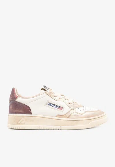 AUTRY MEDALIST LEATHER LOW-TOP SNEAKERS