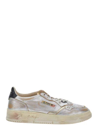 Autry Metallic Low-top Leather Sneaker With Logo Patch On The Tongue In Gold