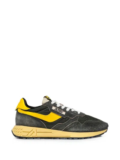 Autry Low-top Sneakers With Textured Grey Upper And Bold Yellow Accents In Gray