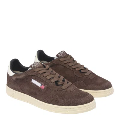 Autry Low Top Suede Sneakers With Contrast Sole In Brown