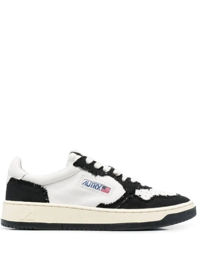 Autry Sneakers In Black And White Leather And Canvas
